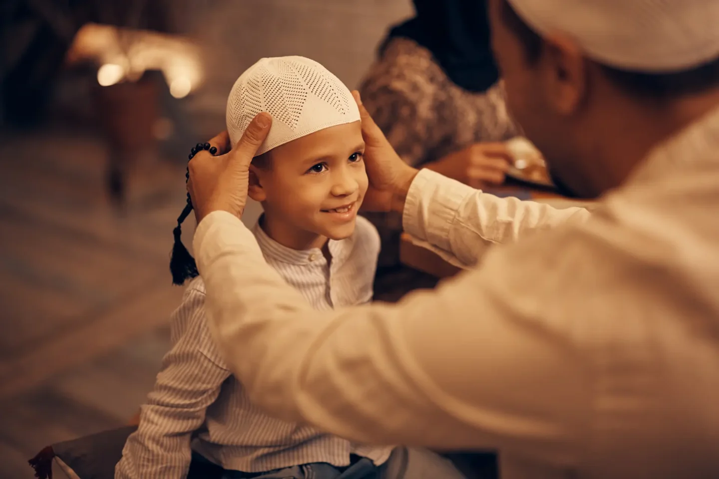 happy muslim boy looking at his father who is adju 2024 12 13 18 37 03 utc